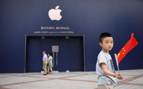 为何苹果在中国能成功 外媒：产品高档+遵守法律.jpg